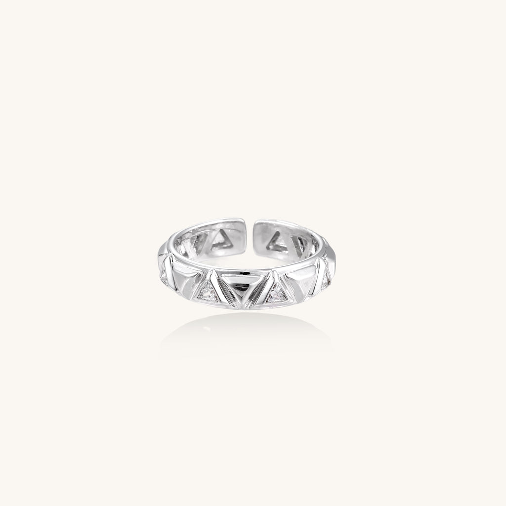 18K gold plated adjustable ring with triangular cutout pattern and sparkling zirconia stones on white background.