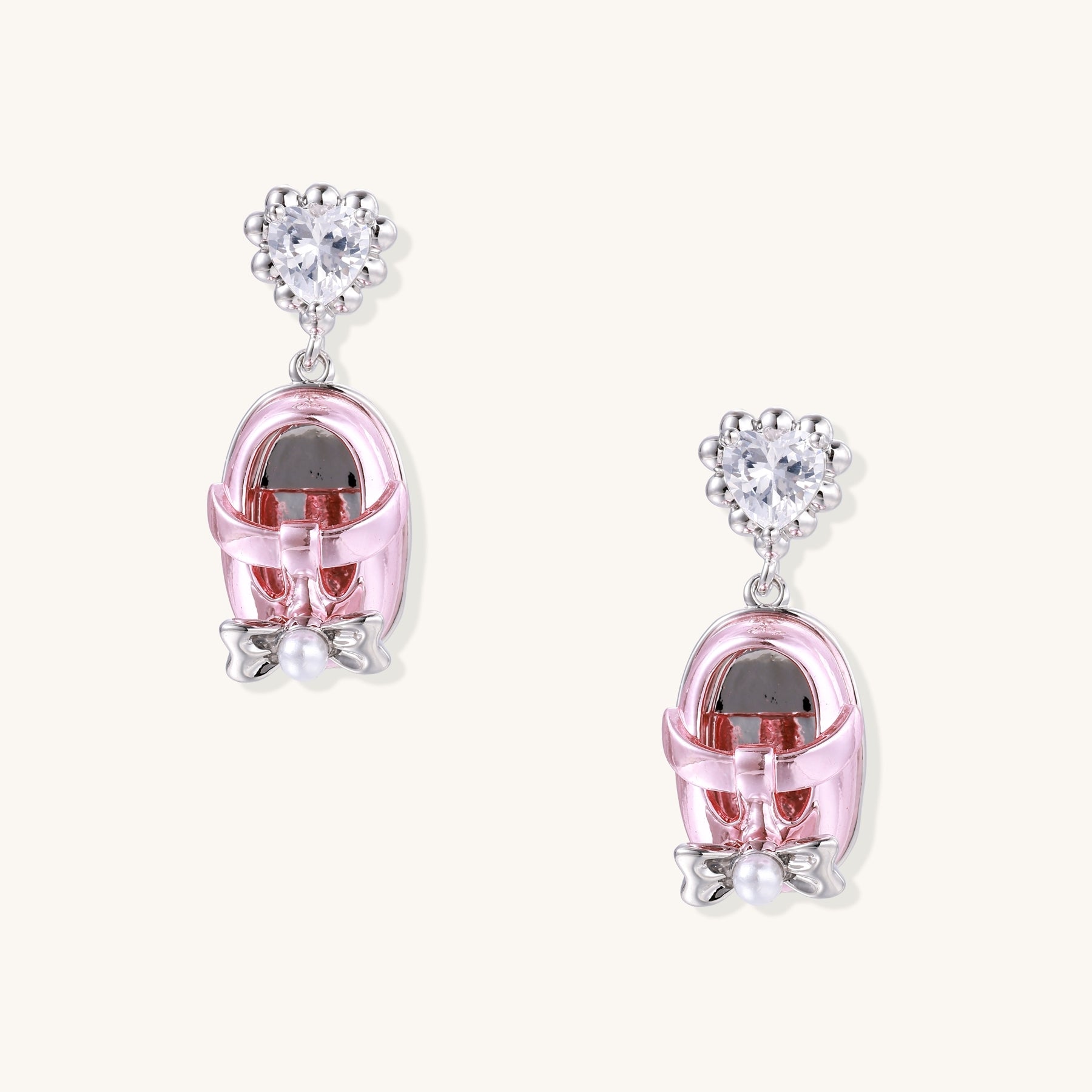 18K gold plated drop earrings with heart-shaped zirconia studs and translucent mini handbag pendants with pearl accents